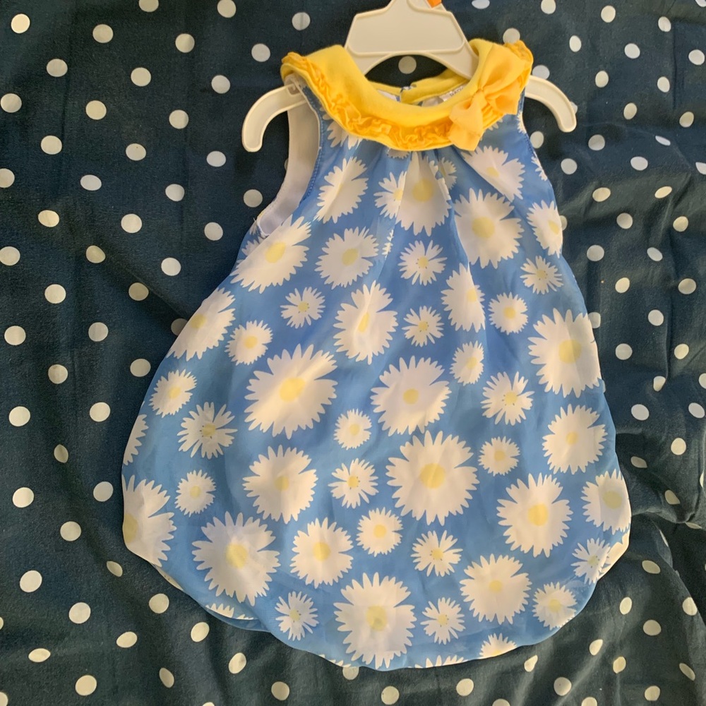 A baby Essential sunflower bubble romper